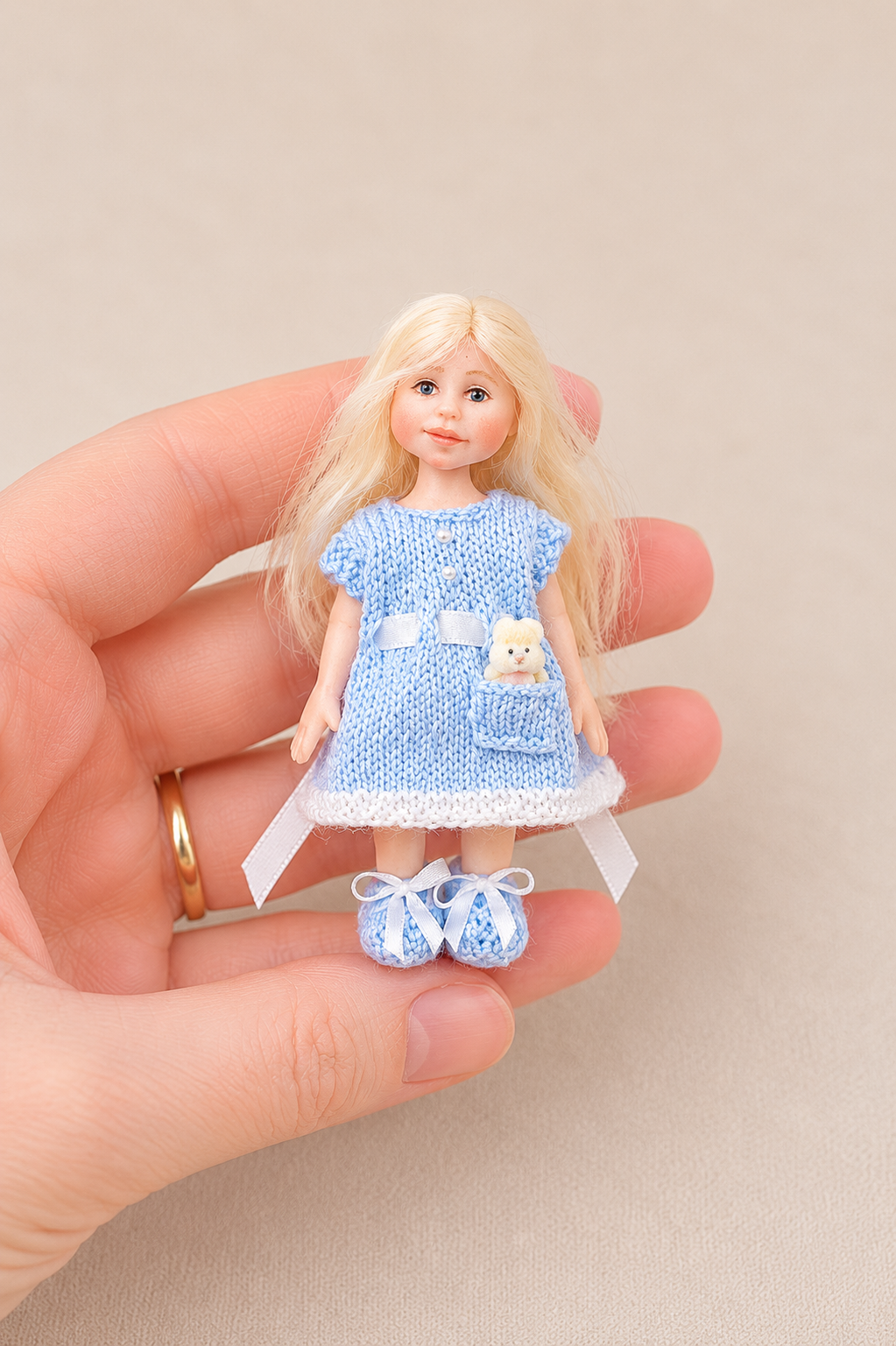 Miniature toddler blue doll dress with a pocket – handknitted 1:12 scale dollhouse doll clothes